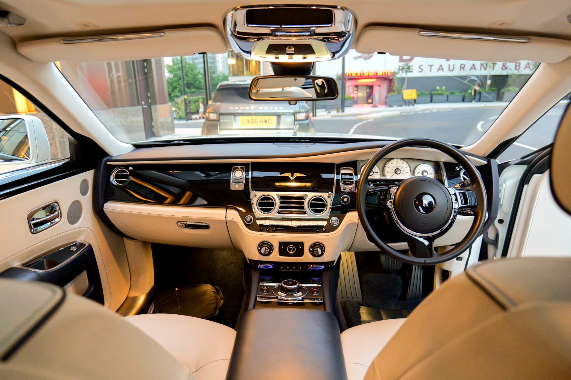 Rolls-Royce Ghost front cabin view with steering wheel and dashboard
